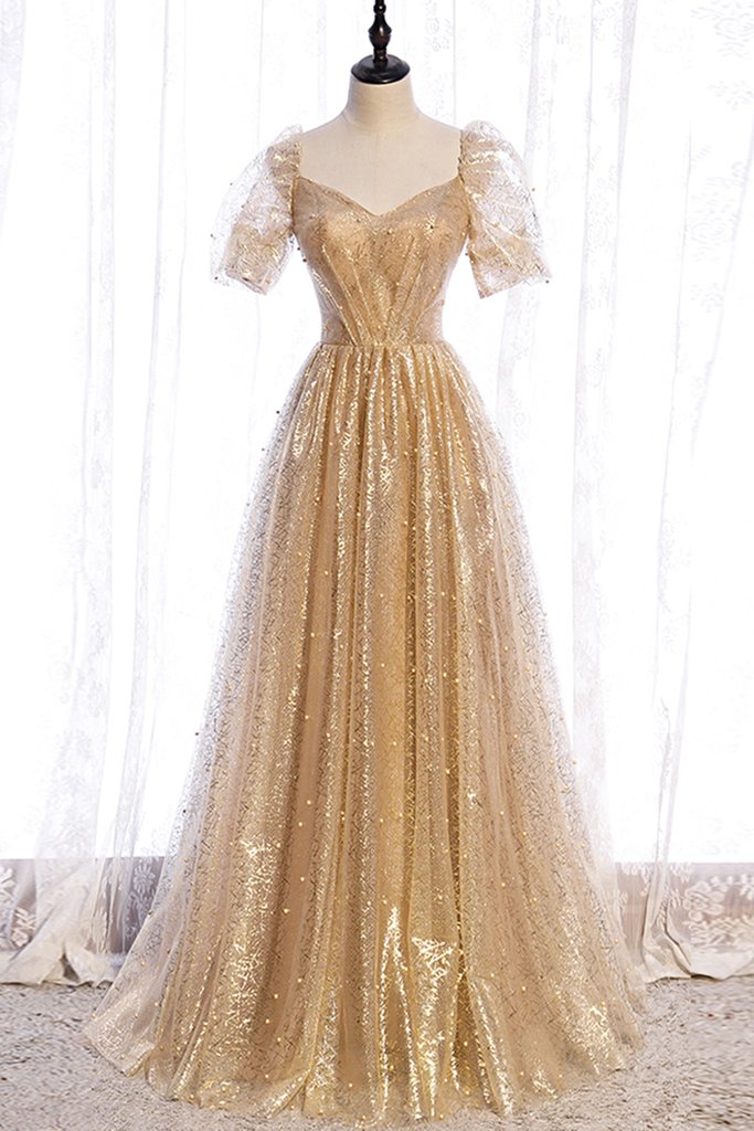 Gold puffy prom dress sales